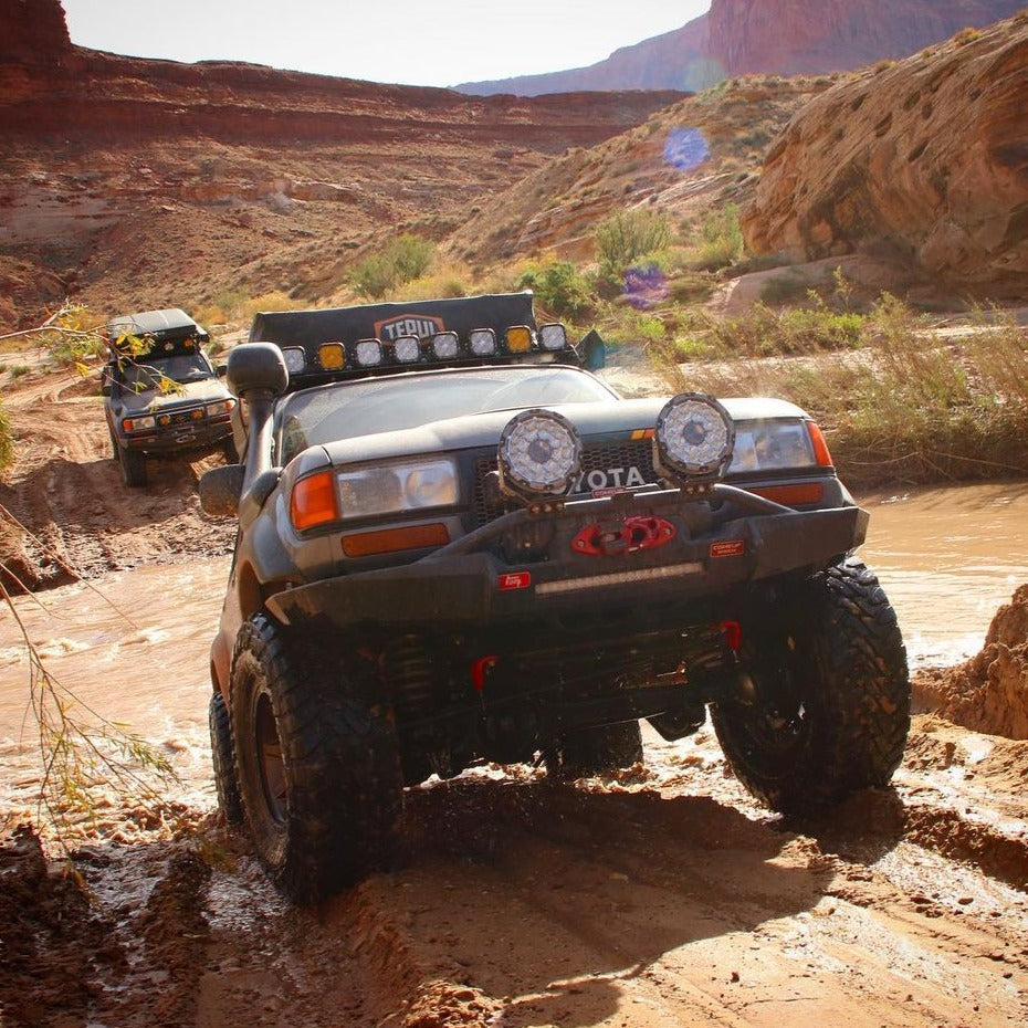 Land Cruiser with 4.5inch CUBE4 light pods on the roof rack and 9'' offroad laser driving light on the front bumper